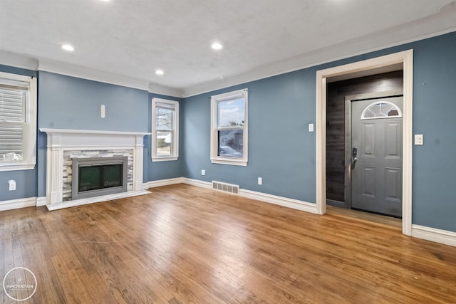 unfurnished living room with hardwood / wood-style flooring