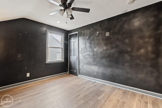 empty room featuring ceiling fan and light wood-type flooring