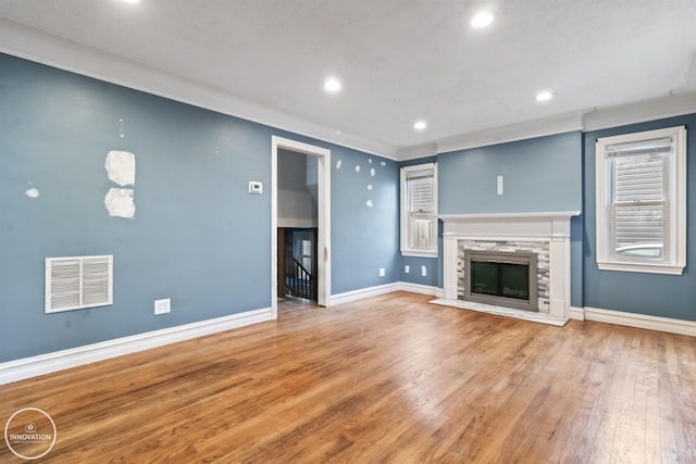 unfurnished living room featuring wood-type flooring