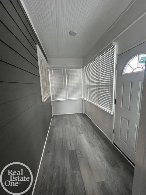 interior space with dark hardwood / wood-style flooring