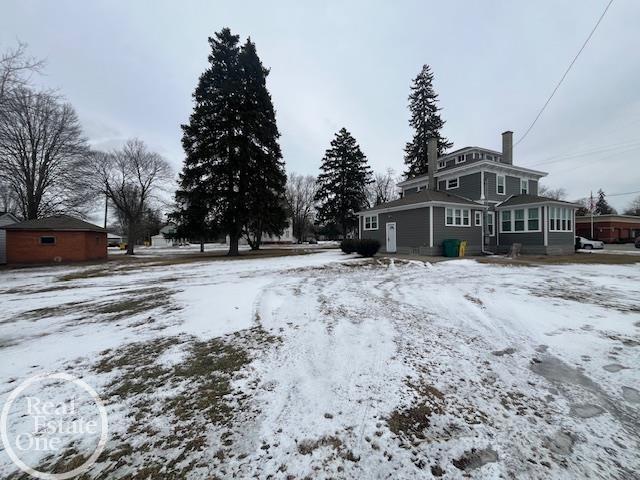 view of yard covered in snow