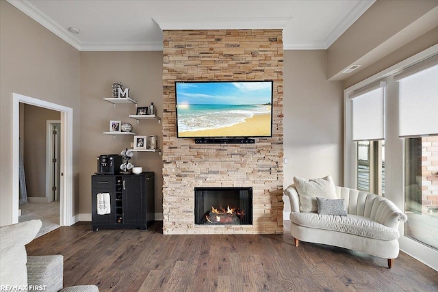 living room featuring a fireplace, crown molding, and dark hardwood / wood-style floors