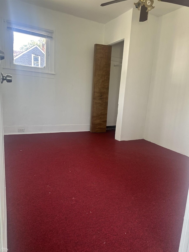 unfurnished room with carpet floors and ceiling fan