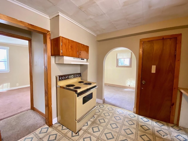 kitchen with ornamental molding, light colored carpet, and white range with electric cooktop