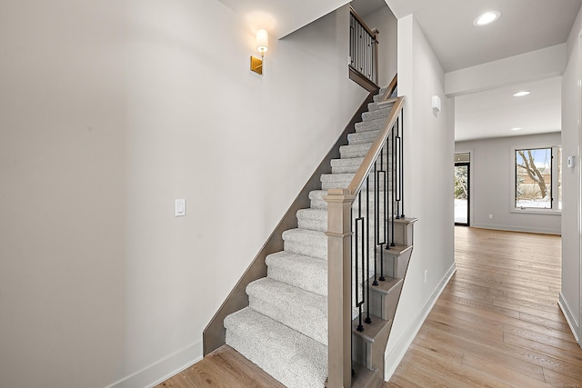 stairway featuring hardwood / wood-style floors