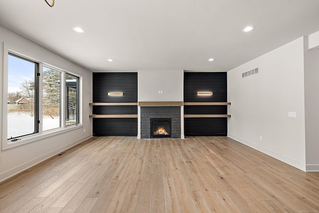 unfurnished living room with light wood-type flooring