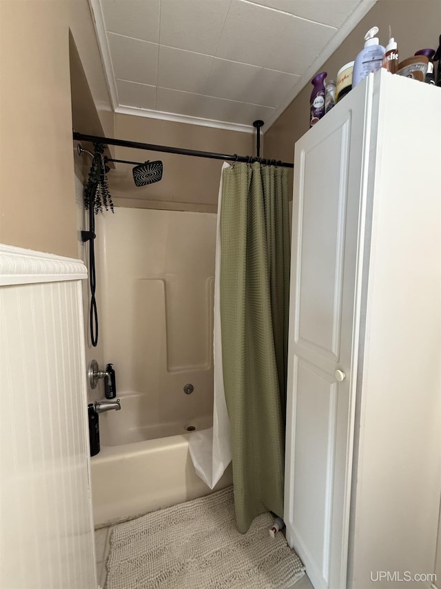 bathroom featuring tile patterned flooring and shower / bath combo with shower curtain