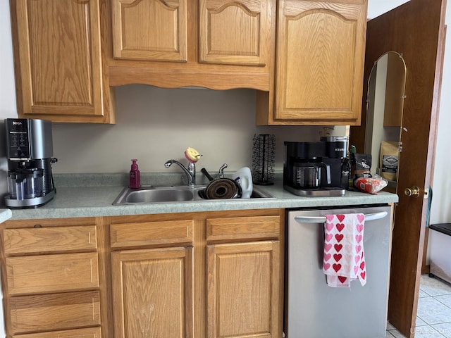 kitchen with sink, light tile patterned floors, and dishwasher