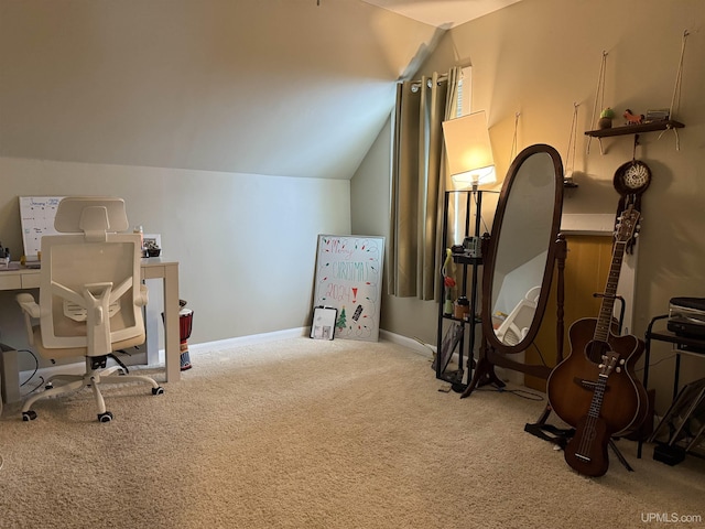 home office with vaulted ceiling and carpet