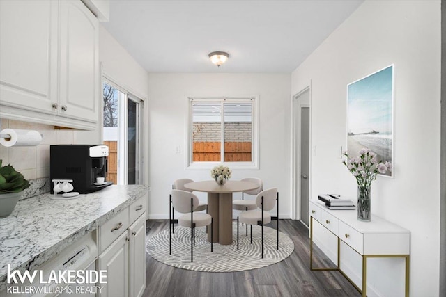 dining space featuring dark hardwood / wood-style floors