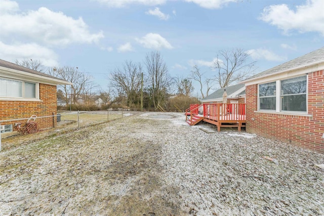 view of yard featuring a wooden deck