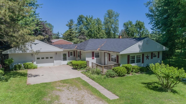 ranch-style house with a garage and a front lawn