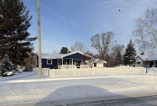 ranch-style home with a fenced front yard