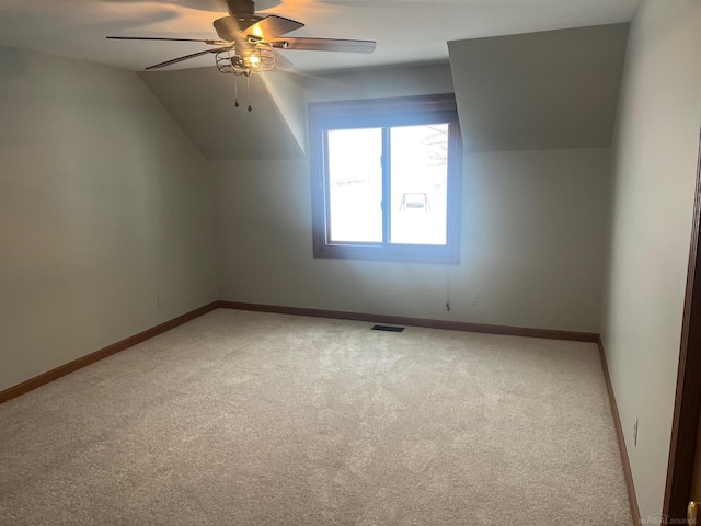 bonus room with ceiling fan, lofted ceiling, and carpet