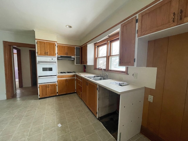 kitchen featuring sink and white appliances