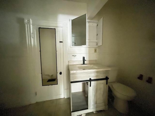 bathroom with vanity and toilet