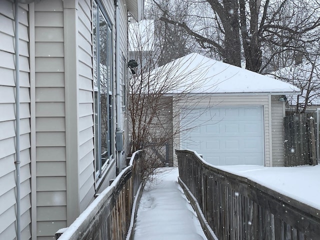 view of snow covered garage