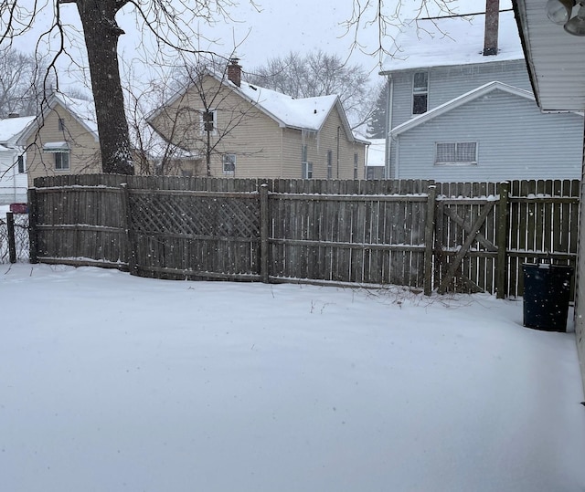 view of yard layered in snow