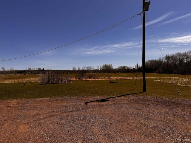 view of green lawn with a view of rural / pastoral area