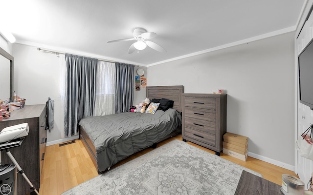 bedroom featuring wood-type flooring and ceiling fan