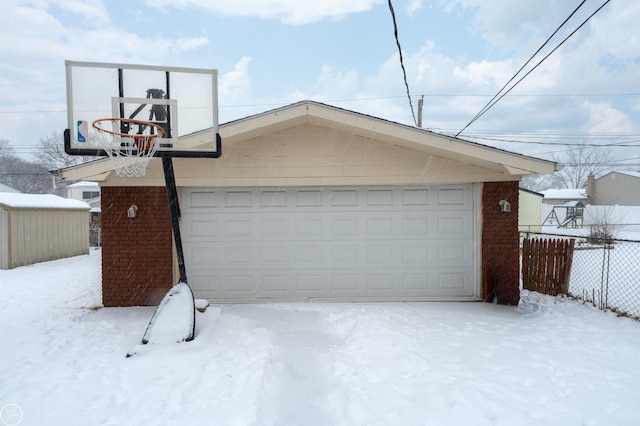 view of snow covered garage