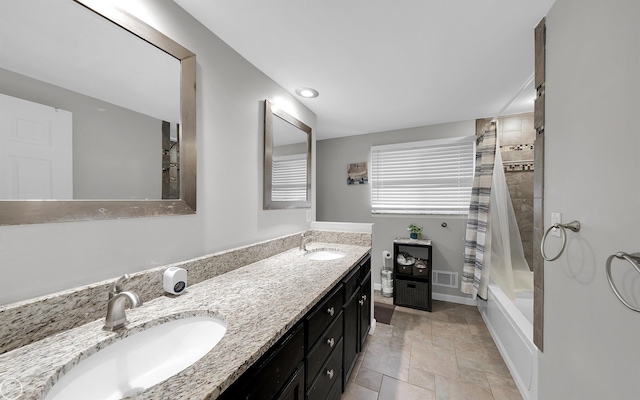 bathroom with vanity and shower / bath combination with curtain