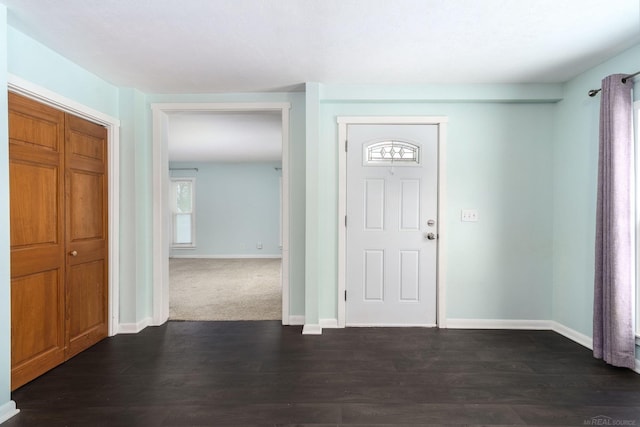 entryway with dark hardwood / wood-style floors