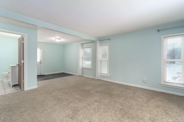 empty room featuring light colored carpet