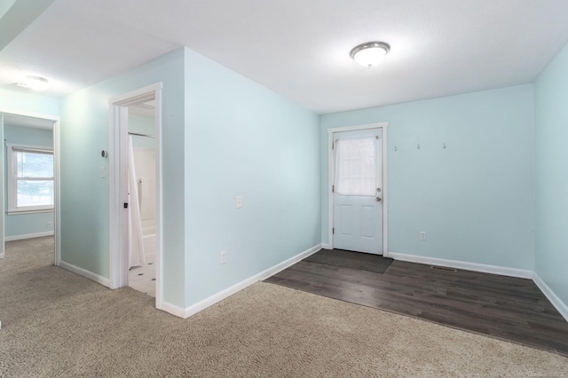 view of carpeted entrance foyer