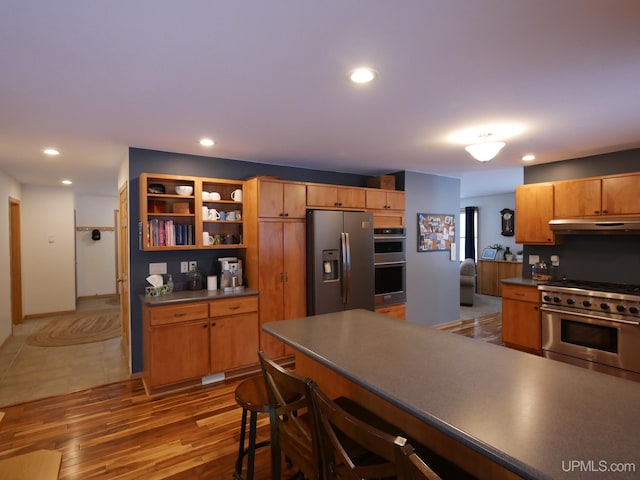 kitchen featuring light hardwood / wood-style flooring and stainless steel appliances