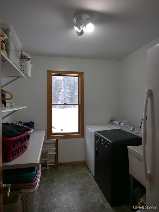 washroom with washing machine and clothes dryer