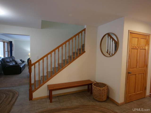 stairway with tile patterned flooring