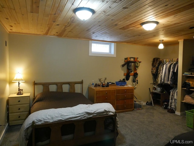 bedroom featuring ornamental molding, wooden ceiling, and carpet flooring