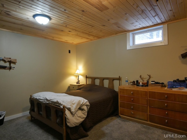 carpeted bedroom with wood ceiling