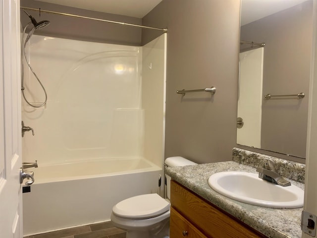 full bathroom with vanity, bathtub / shower combination, and toilet