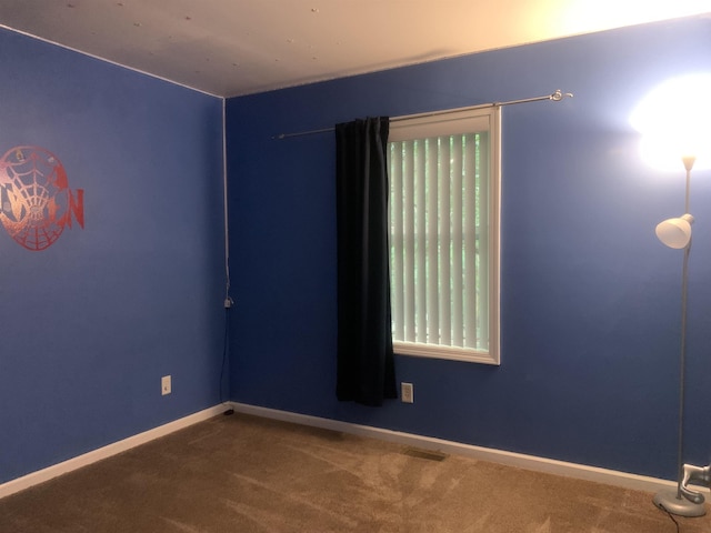 empty room featuring carpet floors