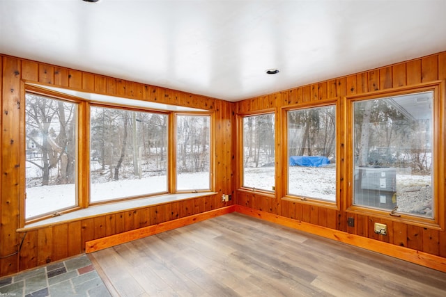 unfurnished sunroom featuring a wealth of natural light