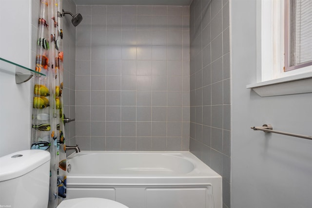 bathroom with shower / bathtub combination with curtain and toilet