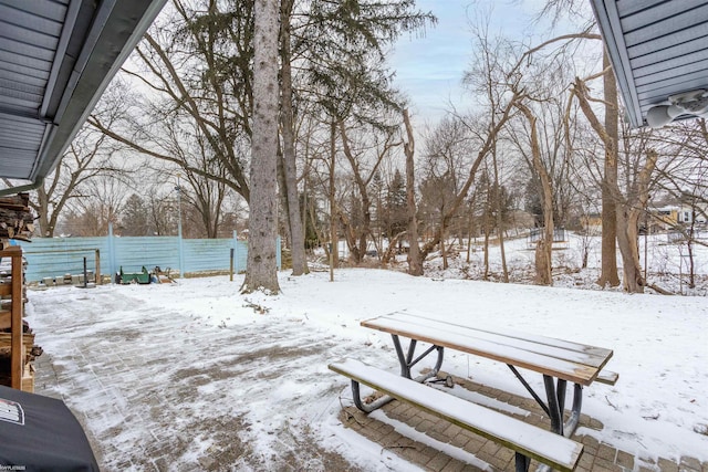 view of yard covered in snow