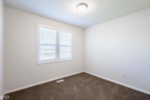 empty room featuring carpet flooring