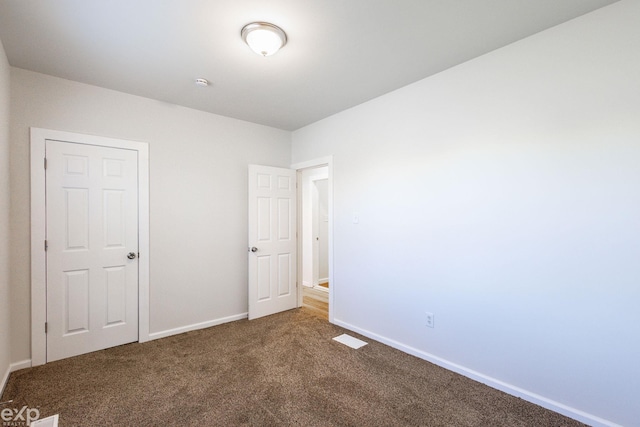 unfurnished bedroom with carpet floors