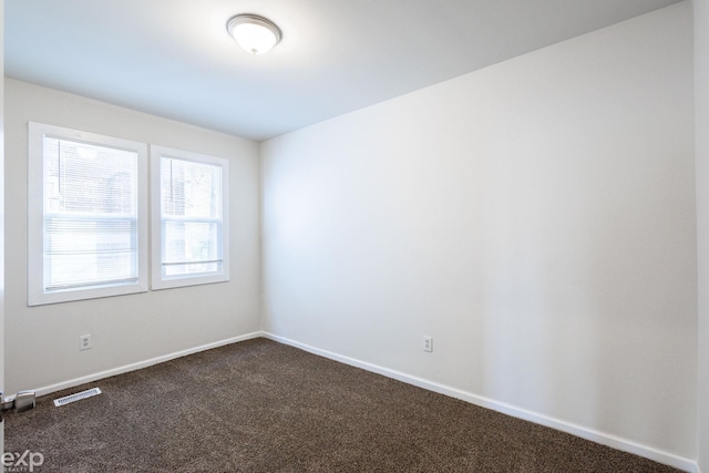 unfurnished room featuring carpet