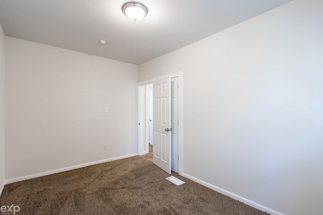 spare room featuring carpet floors