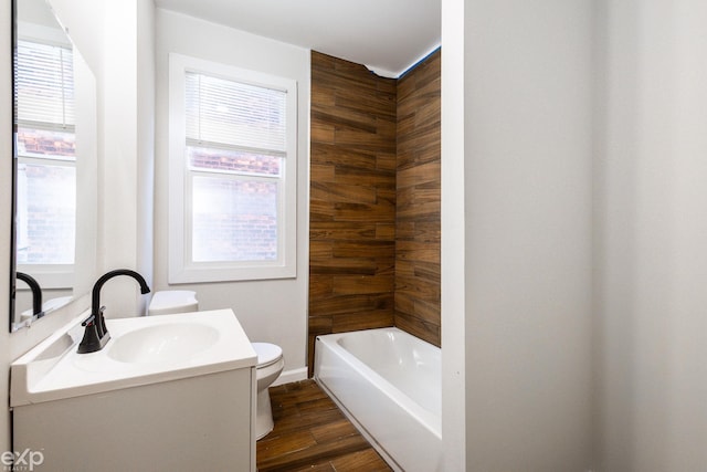 bathroom featuring hardwood / wood-style flooring, vanity, and toilet