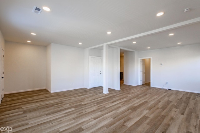 spare room featuring light wood-type flooring