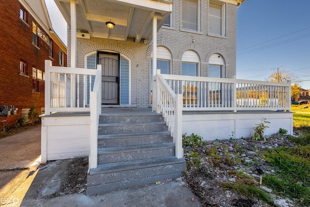 entrance to property with a porch