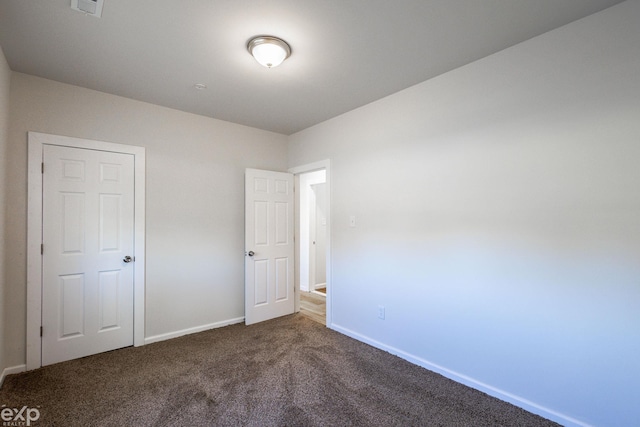 unfurnished bedroom featuring carpet