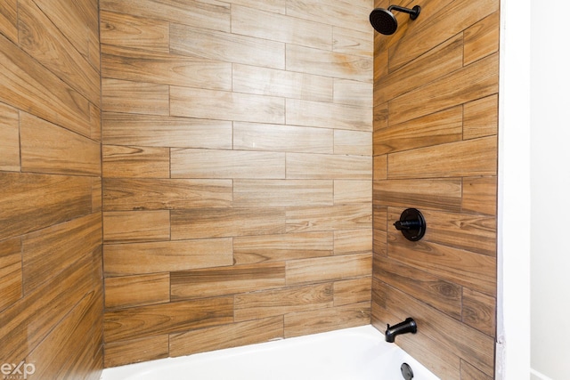 interior details with tiled shower / bath