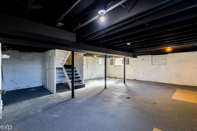 basement with brick wall