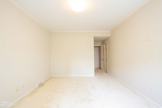 carpeted spare room with ornamental molding